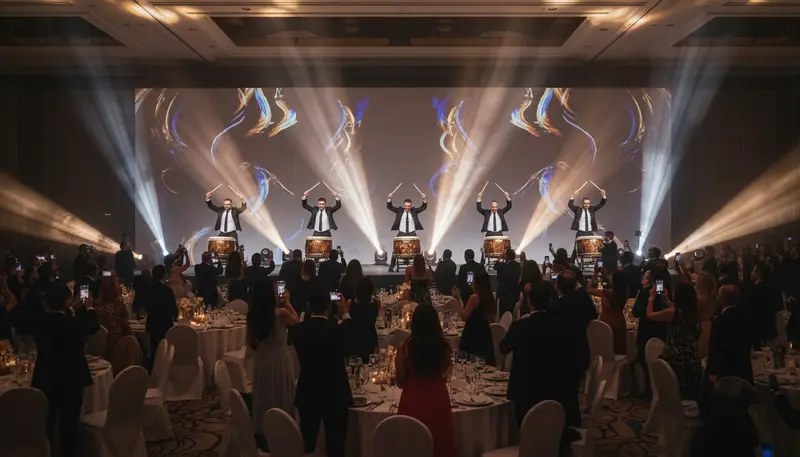 Drummers playing a high energy drum show on stage to open a corporate event in a Dubai hotel ballroom